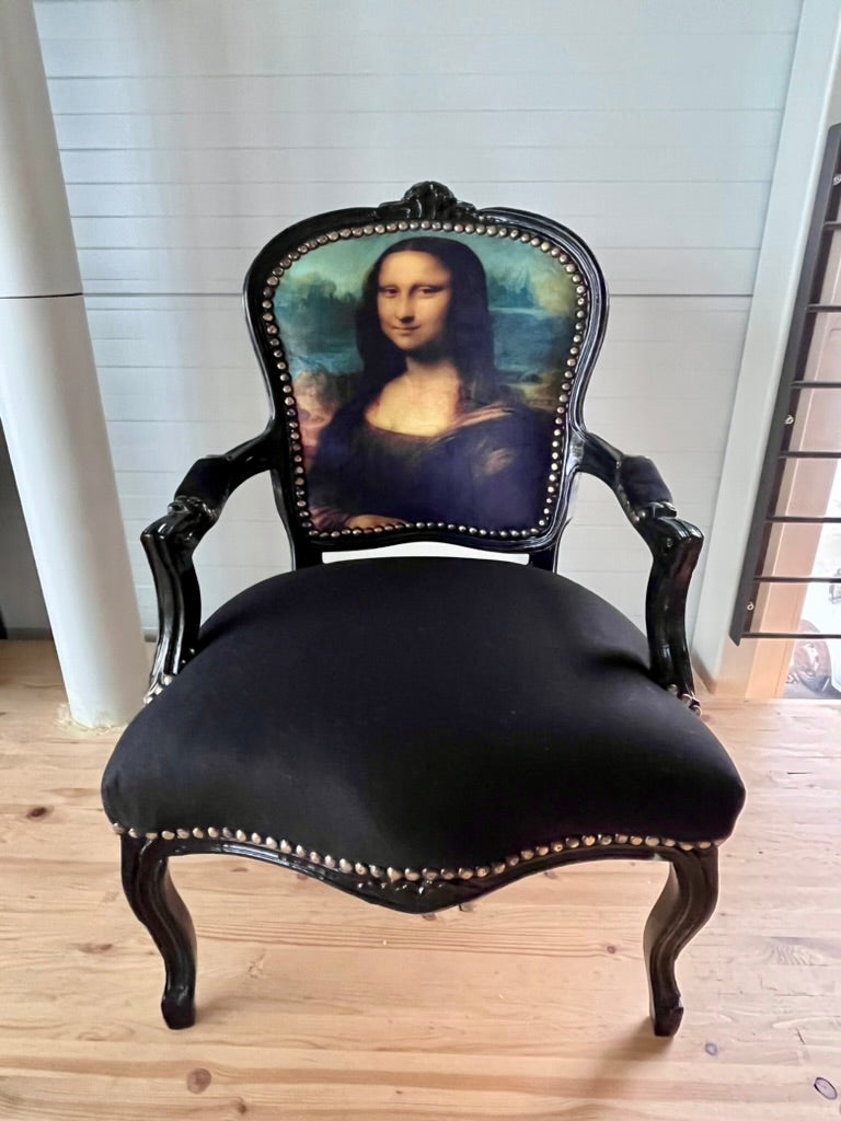 Black Louis XV Baroque armchair by CasAmin Möbel featuring black and white fabric with star portrait design.