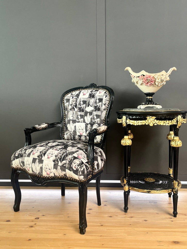 Black Louis XV baroque armchair by CasAmin Möbel featuring black and white upholstery with star portrait design, elegant furniture piece.