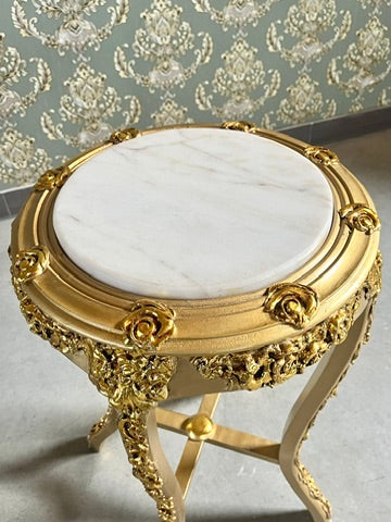 Small gold end table with beige marble top and hand-carved gilded details, perfect as a decorative side table.