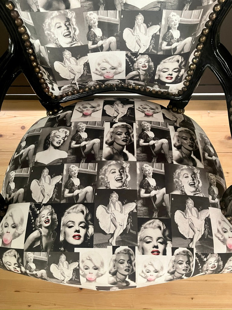Black Louis XV Baroque armchair by CasAmin Möbel featuring black and white upholstery with star portrait design.