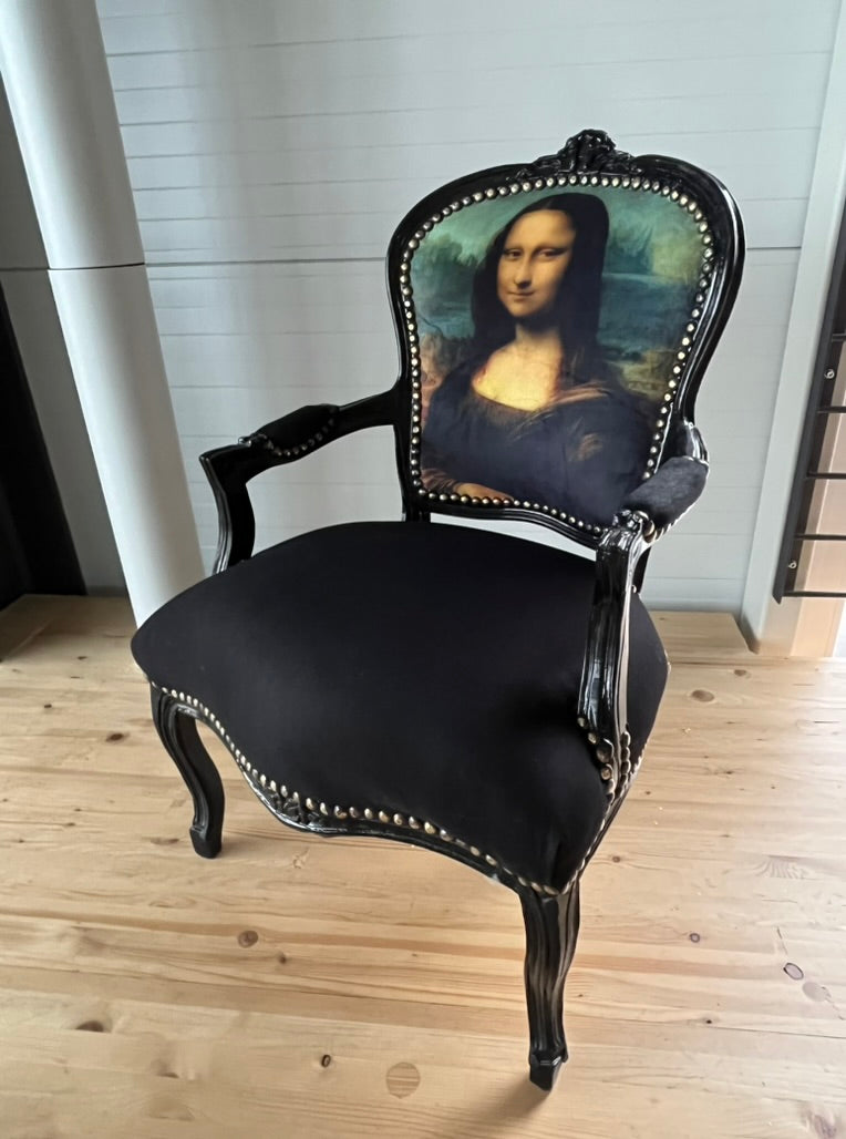 Black Louis XV Baroque armchair by CasAmin Möbel featuring elegant black and white upholstery and classic star-shaped design.