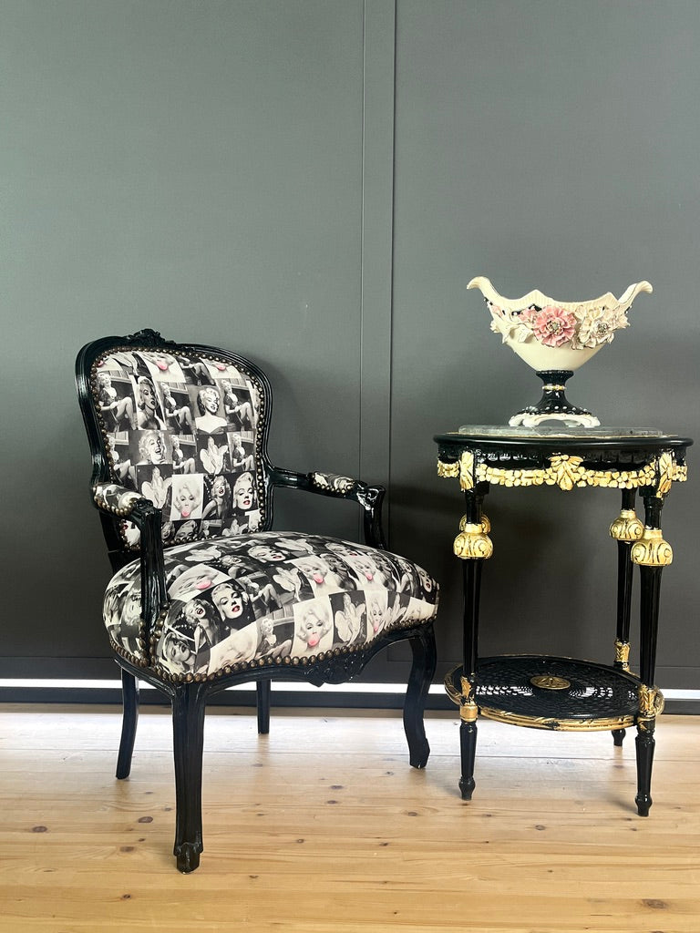 Black Louis XV Baroque armchair by CasAmin Möbel featuring black and white upholstery with star portrait design, elegant furniture piece.